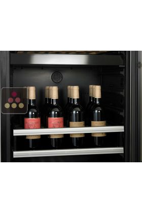 Sliding tray for vertical bottles storage