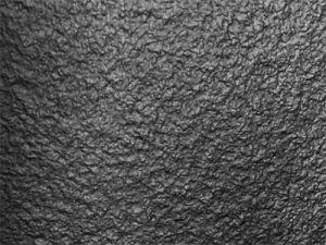 Cladding covered with a textured Black finish laminate